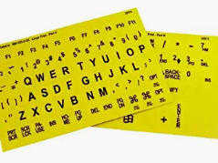 A picture of Braille keyboard stickers to adhere to a computer keyboard.