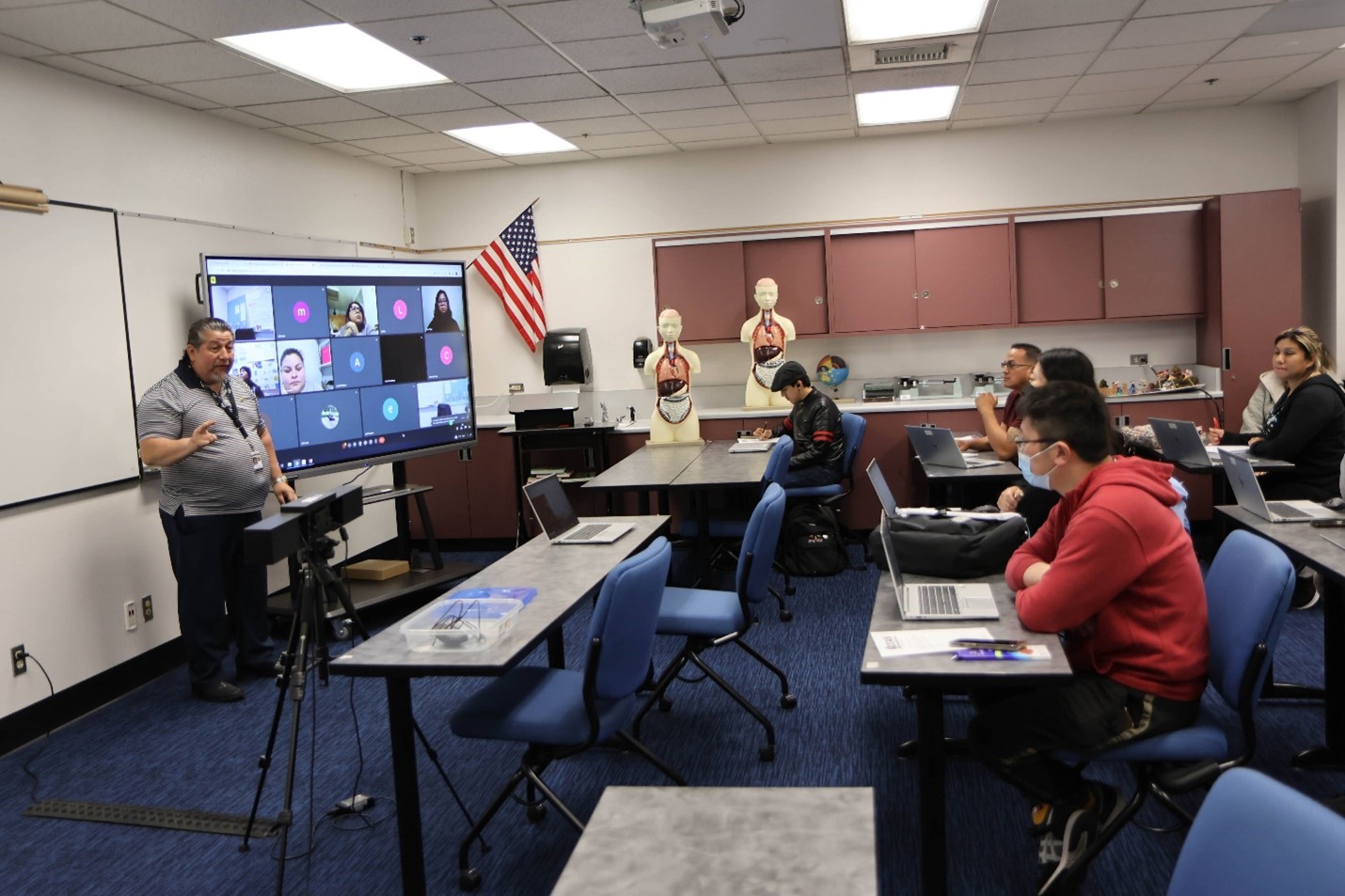 A teacher teaching students in a classroom