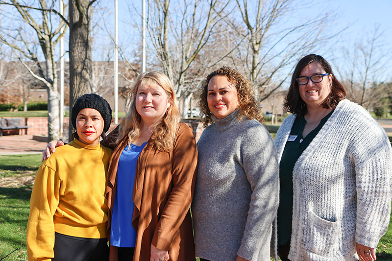 Members of the Apple Valley Adult School DLAC team with their coach