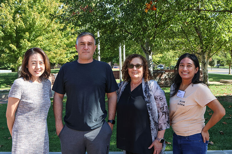 Members of the East Side Adult Education DLAC team with their coach