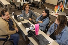 students in a classroom having a discussion