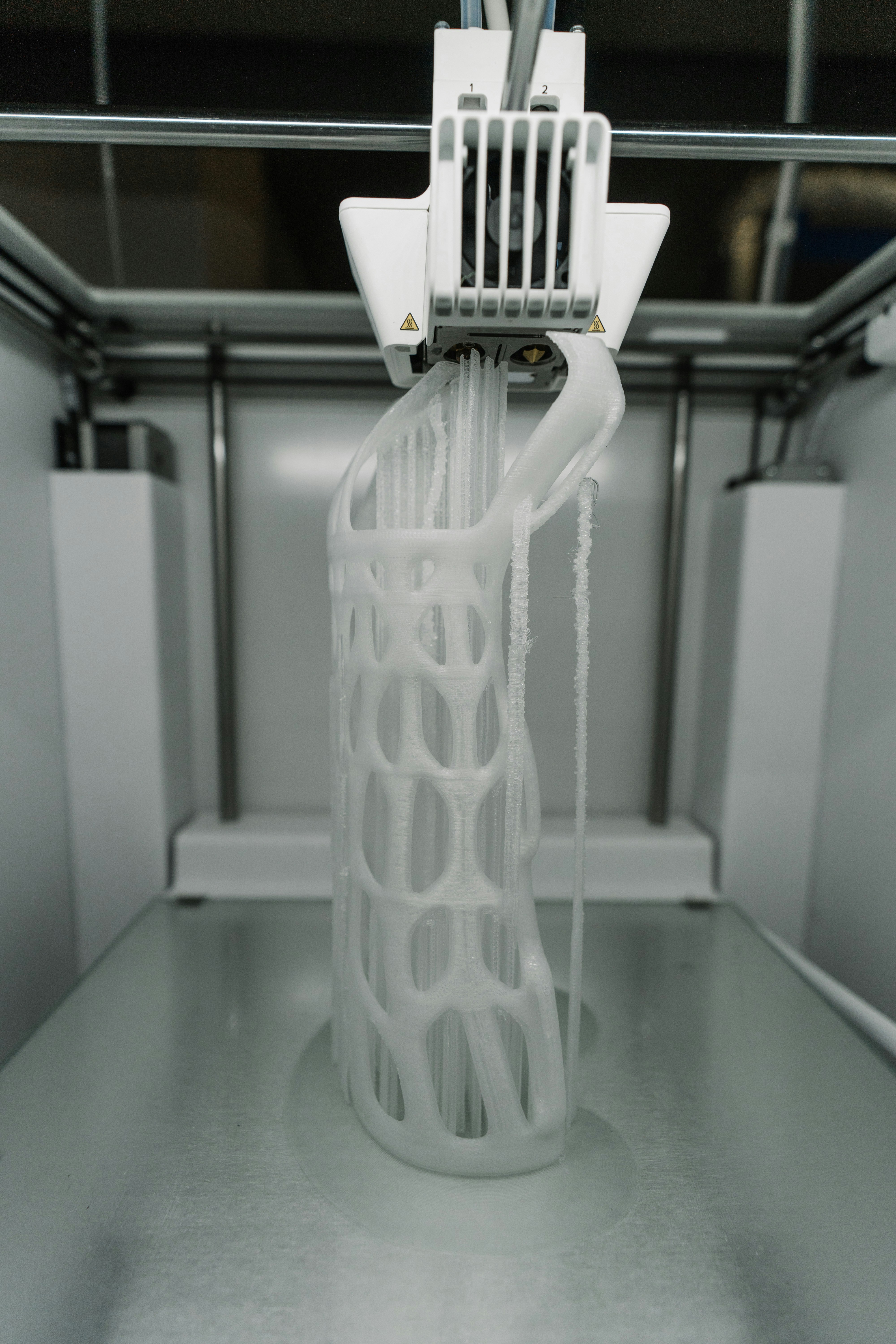 3D printer printing a figure sculpture
