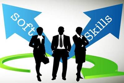 Silhouettes of three people in business attire. Behind them is the title: Soft Skills