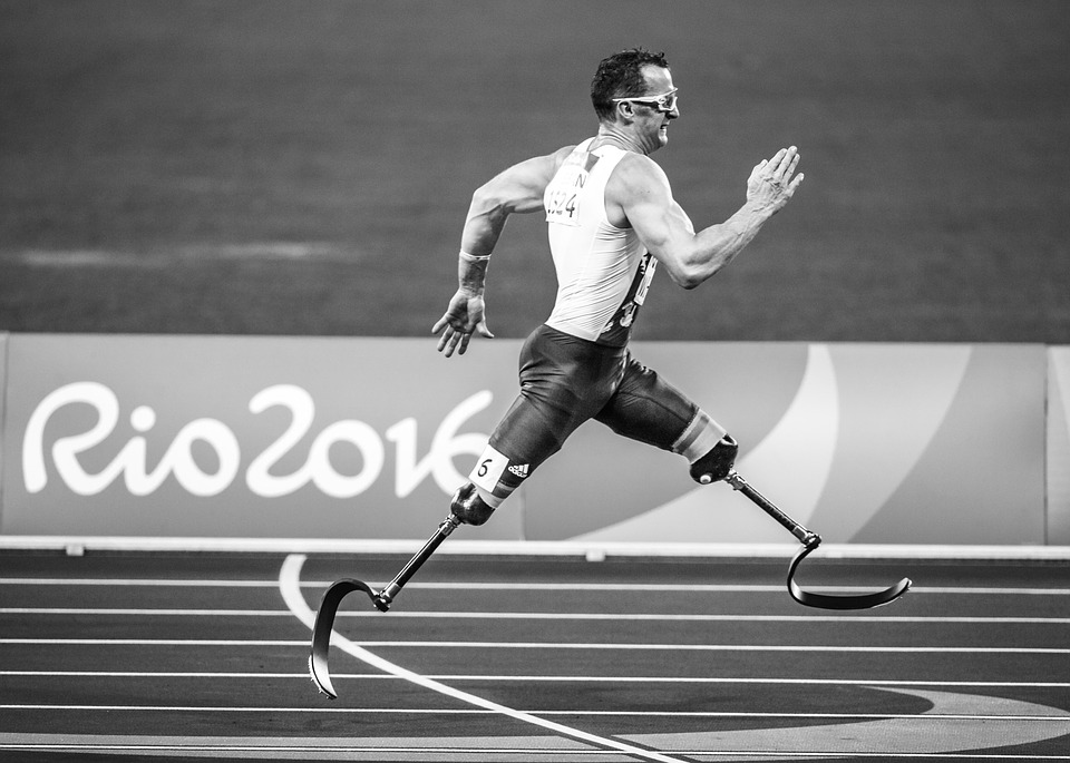 Man running with prosthetic leg