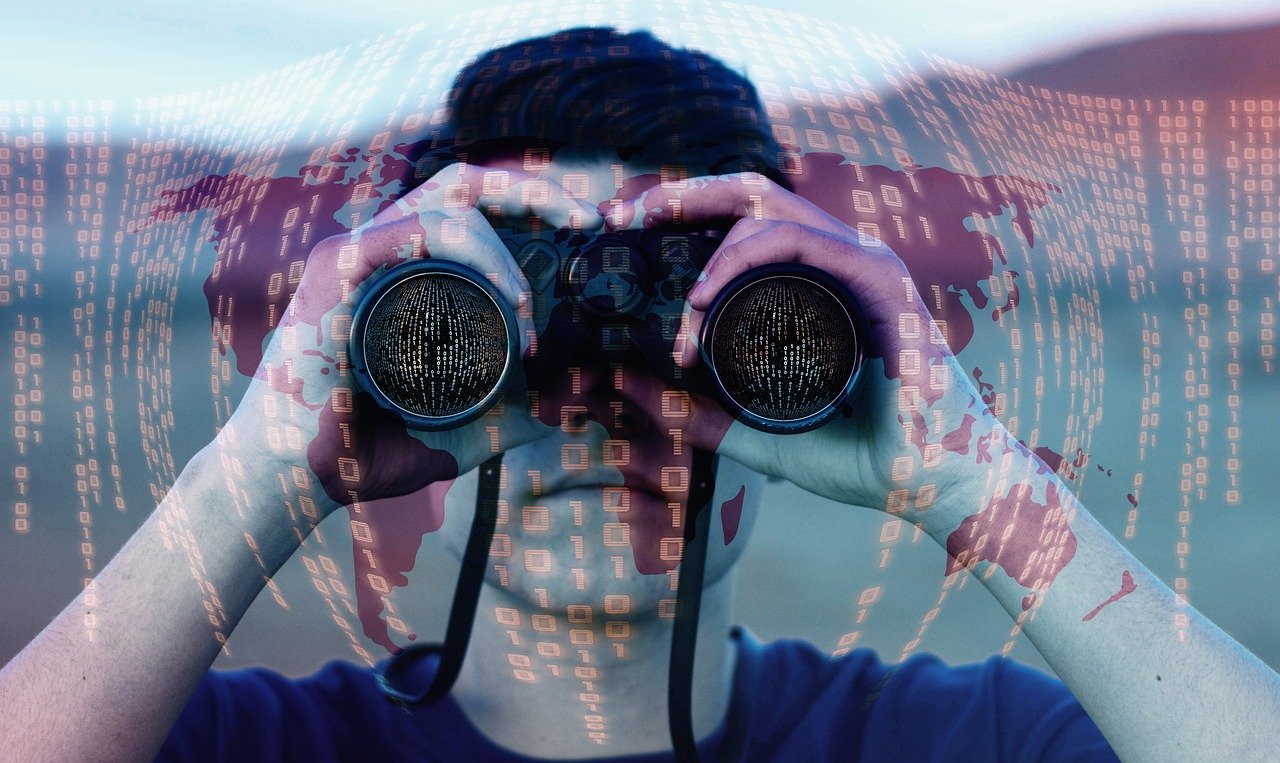 Stylized photo of man looking through binoculars.