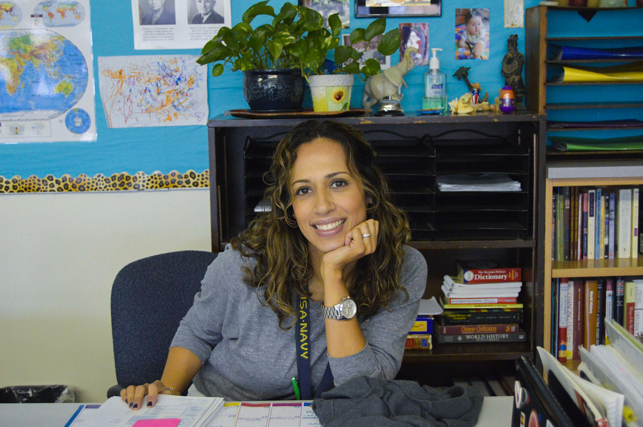 Image of woman teacher sitting at desk